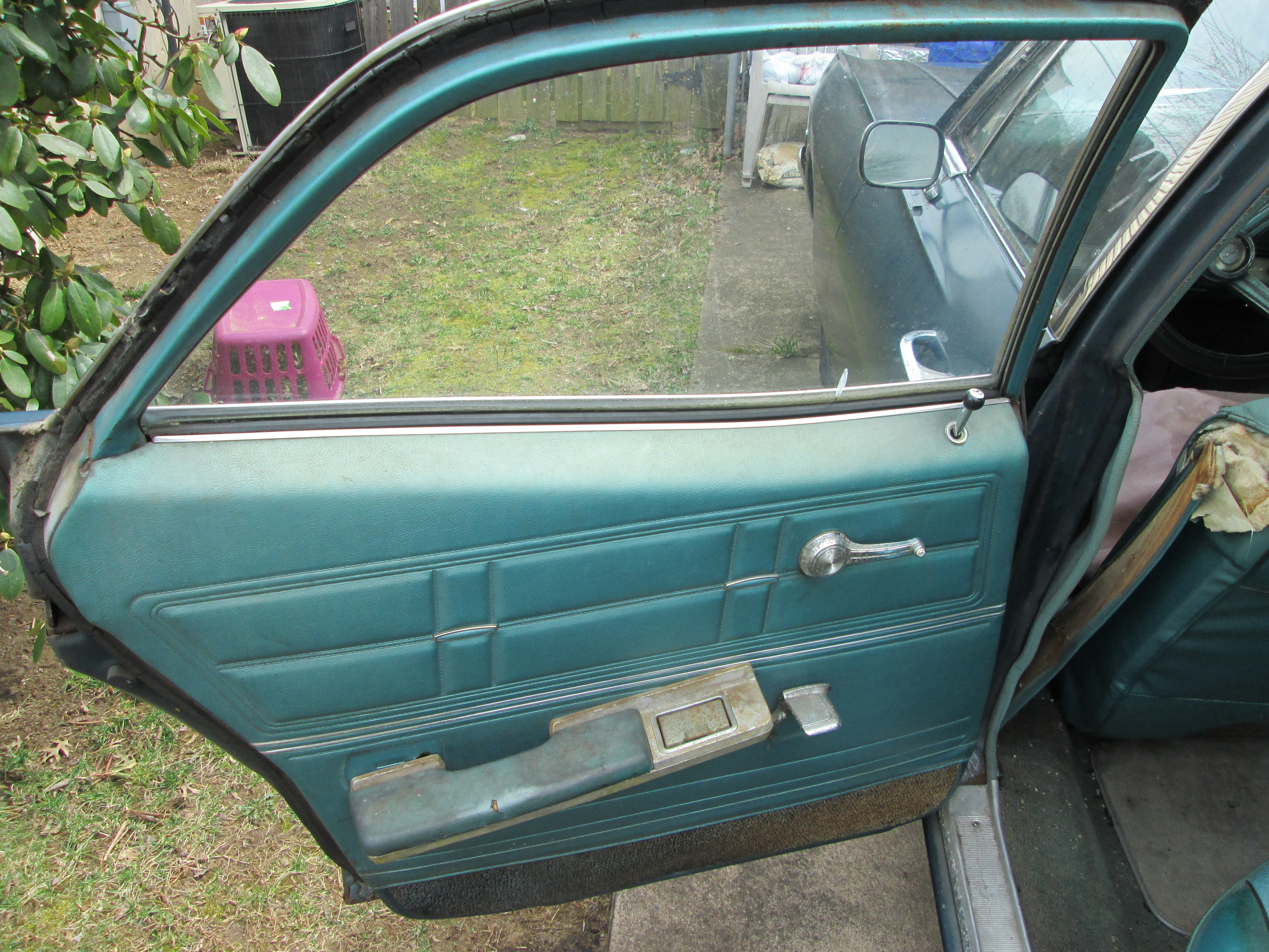 Rear driver side door, arm rest needs to be repaired, that'll probably be addressed during the re-upholstery